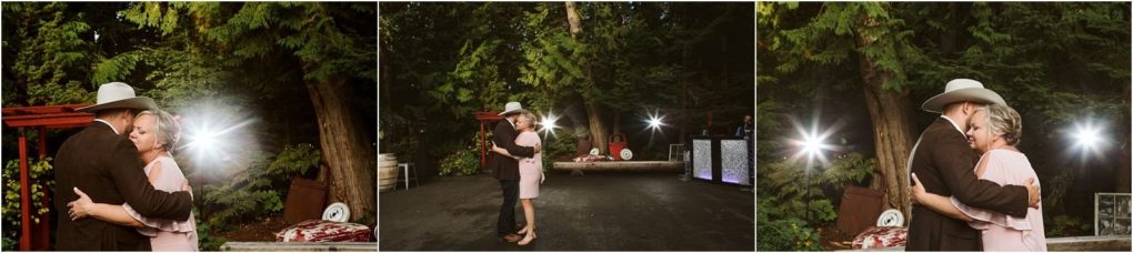 Premier snohomish & seattle wedding photographer | gsquared weddings photography a couple dances outdoors on a paved area surrounded by tall trees at their snohomish engagement The man wears a cowboy hat and suit the woman a light pink dressholding each other closely smiling under soft evening lighting | serving snohomish seattle                   & beyond