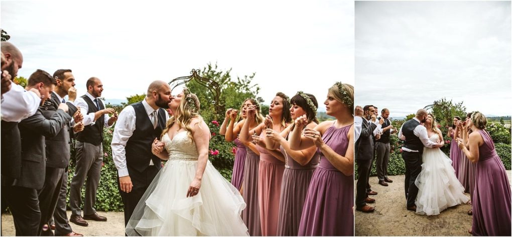 Premier snohomish & seattle wedding photographer | gsquared weddings photography a bride and groom share a kiss outdoors at their snohomish wedding while guests in formal attire including bridesmaids in purple dresses blow bubbles around them The joyful celebration unfolds amid lush greenery and cloudy skies | serving snohomish seattle                   & beyond