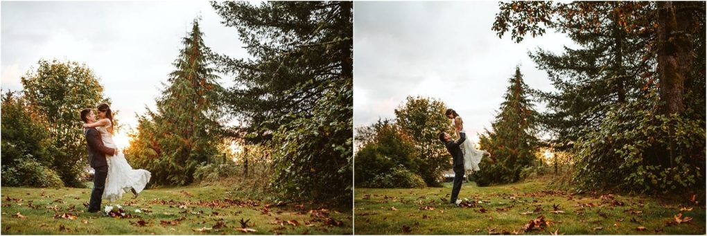 Premier snohomish & seattle wedding photographer | gsquared weddings photography a couple stands outside on grass surrounded by tall trees The man lifts the woman in a wedding dress both smiling and joyful with fallen leaves and a soft sunsetcapturing a perfect snohomish seattle wedding engagement moment | serving snohomish seattle                   & beyond