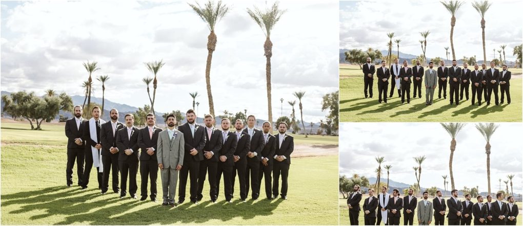 Premier snohomish & seattle wedding photographer | gsquared weddings photography a group of men in suits with one in a light gray suit and the rest in black stand together on a sunny golf course near palm trees and mountains posing formally as if for a snohomish seattle wedding engagement shoot | serving snohomish seattle                   & beyond