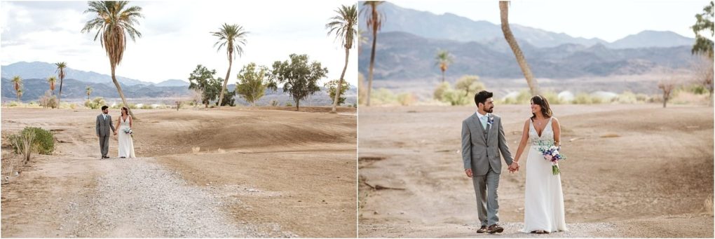 Premier snohomish & seattle wedding photographer | gsquared weddings photography a bride and groom walk hand in hand on a dirt path in a desert landscape surrounded by palm trees and distant mountains under a partly cloudy sky capturing the adventurous spirit of a snohomish seattle wedding engagement | serving snohomish seattle                   & beyond