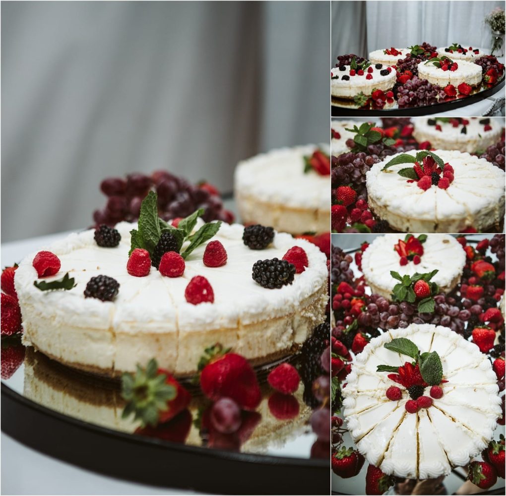 Premier snohomish & seattle wedding photographer | gsquared weddings photography a cheesecake topped with fresh raspberries blackberries strawberries and mint leaves perfect for a snohomish seattle wedding or engagement surrounded by assorted berries and grapes on a reflective surface | serving snohomish seattle                   & beyond