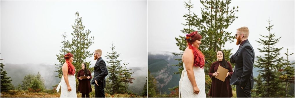 Premier snohomish & seattle wedding photographer | gsquared weddings photography a couple stands facing each other outdoors in wedding attire with an officiant and evergreen trees behind them Misty mountains and a cloudy sky create a scenic snohomish backdrop perfect for a seattle wedding or engagement | serving snohomish seattle                   & beyond