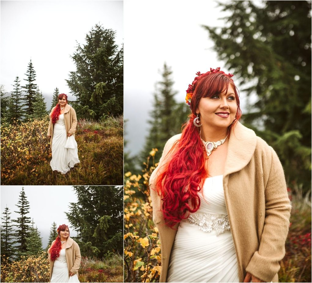 Premier snohomish & seattle wedding photographer | gsquared weddings photography a woman with long red hair in a white dress and tan coat stands outdoors among autumn foliage and evergreen trees smiling and posing for snohomish wedding photos near seattle | serving snohomish seattle                   & beyond