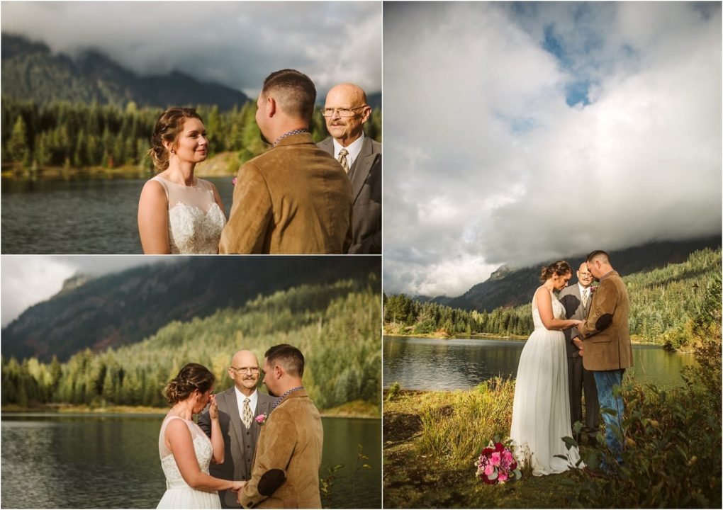 Premier snohomish & seattle wedding photographer | gsquared weddings photography a couple exchanges vows outdoors beside a lake and forested mountains near snohomish with an officiant present Holding hands under a partly cloudy sky this seattle wedding scene is completed by a bouquet of flowers resting on the ground nearby | serving snohomish seattle                   & beyond