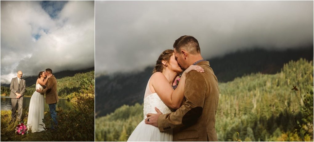 Premier snohomish & seattle wedding photographer | gsquared weddings photography a bride and groom kiss outdoors during their snohomish wedding ceremony with a forested mountain and cloudy sky in the background An officiant stands nearby in one image the couple embrace closely in this seattle engagement moment | serving snohomish seattle                   & beyond