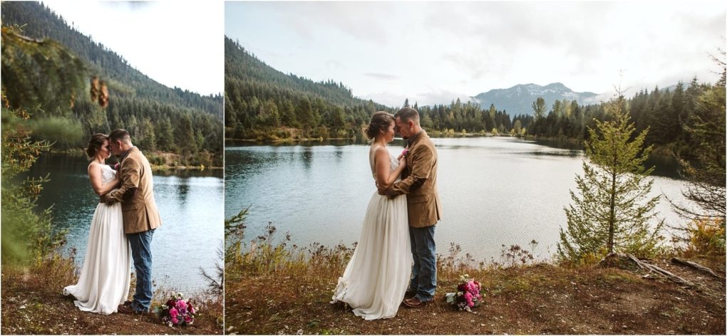 Premier snohomish & seattle wedding photographer | gsquared weddings photography a bride and groom share an intimate moment by a lake surrounded by trees and mountains near seattle with a bouquet of pink flowers resting nearby The sky is partly cloudy capturing the magic of their snohomish wedding engagement | serving snohomish seattle                   & beyond