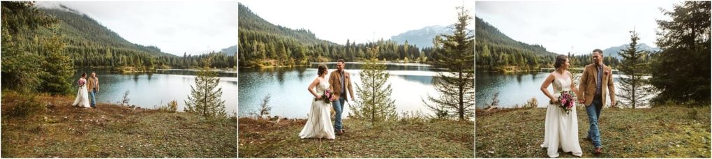 Premier snohomish & seattle wedding photographer | gsquared weddings photography a bride and groom stand by a calm lake surrounded by trees and mountains in snohomish holding hands and smiling at each other on their seattle wedding day | serving snohomish seattle                   & beyond
