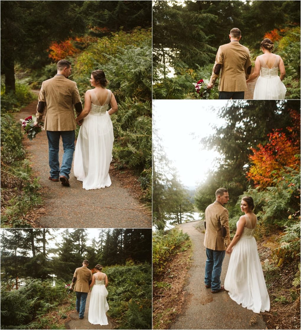 Premier snohomish & seattle wedding photographer | gsquared weddings photography a couple walks together on a forested path in snohomish with the woman in a white dress and the man in jeans and a tan jacket Lush greenery and autumn foliage create a romantic seattle wedding engagement setting | serving snohomish seattle                   & beyond