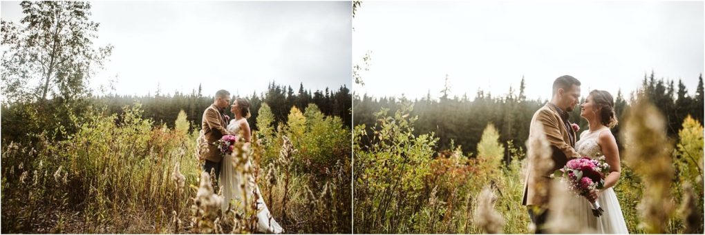Premier snohomish & seattle wedding photographer | gsquared weddings photography a bride and groom stand close together in a sunlit snohomish field of wildflowers and tall grass surrounded by trees smiling at each other on their wedding day The bride holds a bouquet of pink flowers | serving snohomish seattle                   & beyond