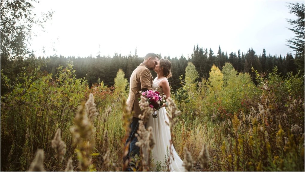Premier snohomish & seattle wedding photographer | gsquared weddings photography a bride and groom stand close together holding a bouquet of flowers in a field surrounded by tall grasses and trees near snohomish with a forest in the background under a bright seattle sky | serving snohomish seattle & beyond Premier snohomish & seattle wedding photographer | gsquared weddings photography a bride and groom stand close together holding a bouquet of flowers in a field surrounded by tall grasses and trees near snohomish with a forest in the background under a bright seattle sky | serving snohomish seattle & beyond