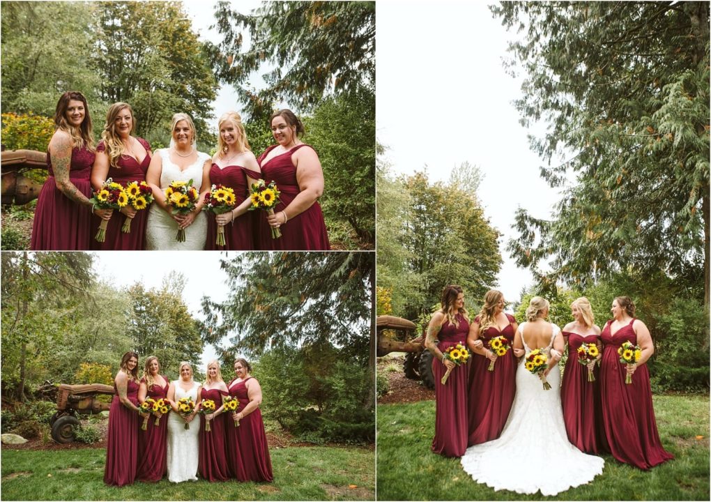 Premier snohomish & seattle wedding photographer | gsquared weddings photography a bride in a white dress stands with four bridesmaids in matching burgundy dresses holding sunflower bouquets posing together outdoors among trees and greenery at a charming snohomish seattle wedding | serving snohomish seattle                   & beyond