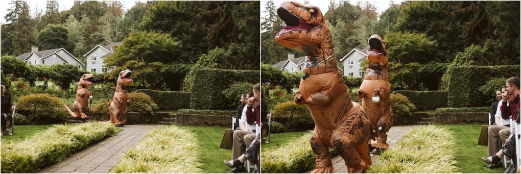Premier snohomish & seattle wedding photographer | gsquared weddings photography two people in inflatable t rex costumes walk down an outdoor wedding aisle at a lush snohomish garden surrounded by guests This whimsical scene captures the playful spirit of a seattle wedding or engagement celebration | serving snohomish seattle                   & beyond