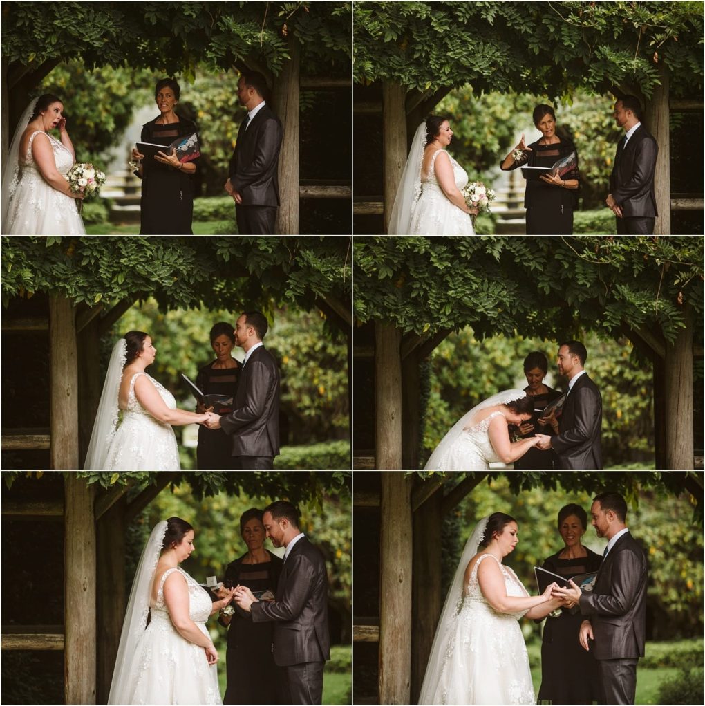 Premier snohomish & seattle wedding photographer | gsquared weddings photography a bride and groom stand under a wooden arch exchanging vows and rings during a beautiful snohomish outdoor wedding ceremony with an officiant smiling in the background | serving snohomish seattle                   & beyond