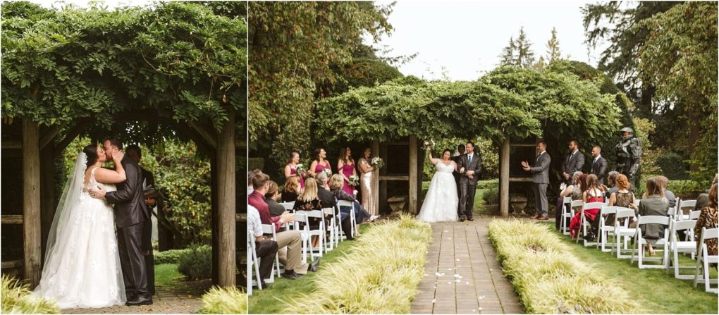 Premier snohomish & seattle wedding photographer | gsquared weddings photography a bride and groom share their first kiss under a leafy arbor during a beautiful snohomish outdoor wedding ceremony while guests seated on white chairs watch and celebrate around them | serving snohomish seattle                   & beyond