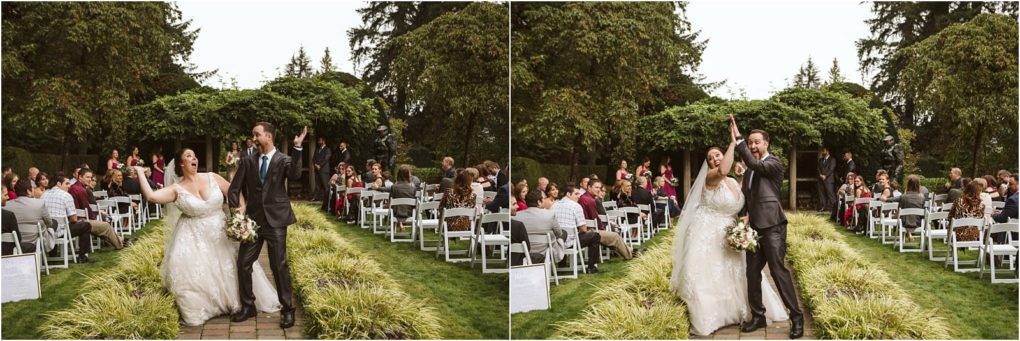 Premier snohomish & seattle wedding photographer | gsquared weddings photography a newly married couple joyfully walks down an outdoor aisle lined with seated guests holding hands and celebrating among lush greenery and trees at their romantic snohomish seattle wedding | serving snohomish seattle                   & beyond