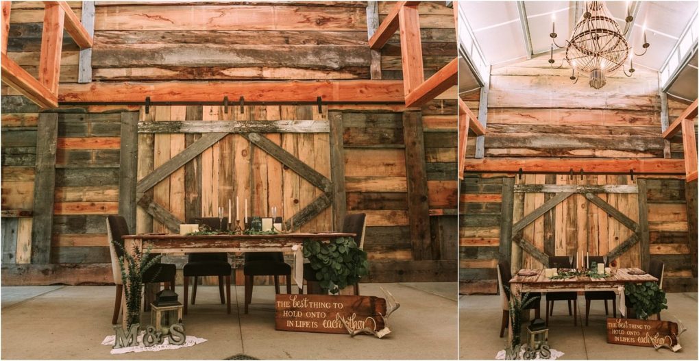 Premier snohomish & seattle wedding photographer | gsquared weddings photography a rustic snohomish wedding sweetheart table sits in front of large wooden barn doors decorated with greenery candles and a wooden sign Weathered wood walls and a chandelier above create romantic seattle engagement vibes | serving snohomish seattle                   & beyond
