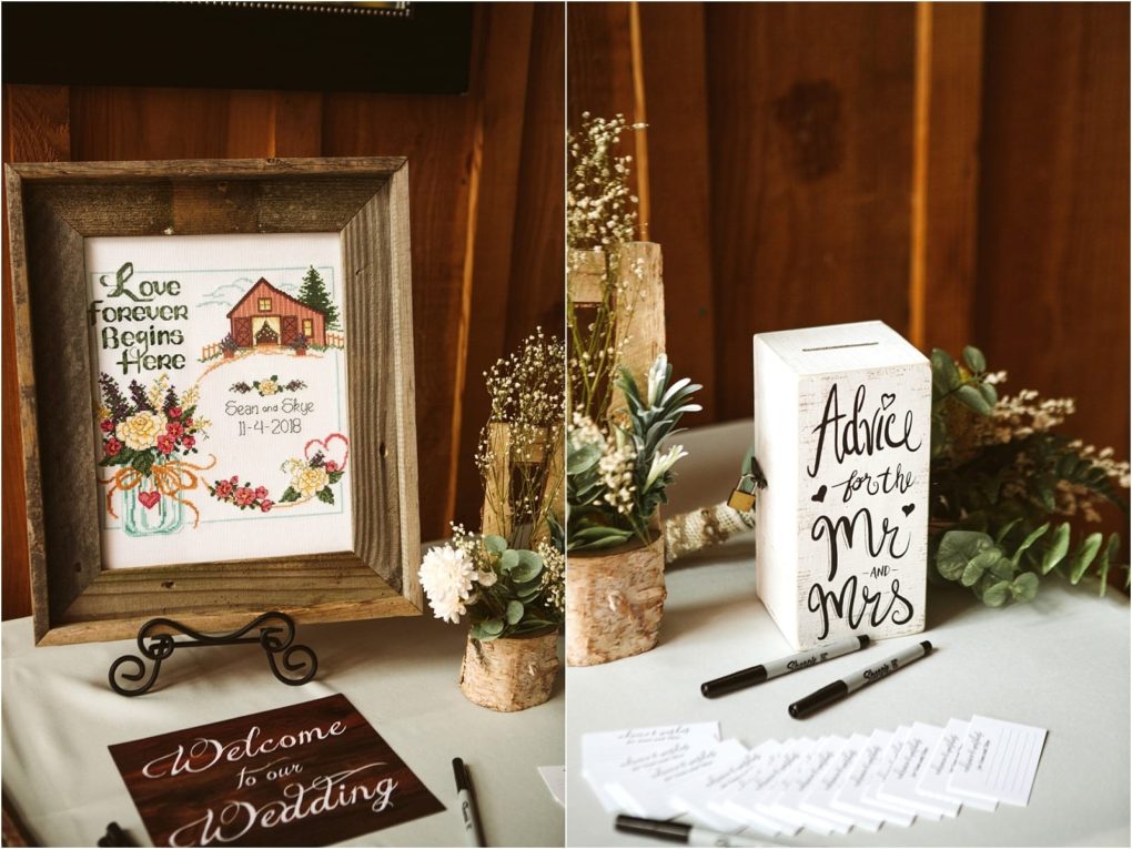 Premier snohomish & seattle wedding photographer | gsquared weddings photography a rustic snohomish wedding display features a framed embroidered sign with love forever begins here a barn and the couples names and date Nearby is a box labeled advice for the mr & mrs surrounded by flowers and pens | serving snohomish seattle                   & beyond