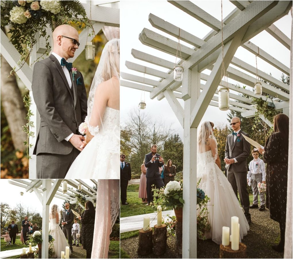 Premier snohomish & seattle wedding photographer | gsquared weddings photography a bride and groom stand under a white pergola decorated with flowers and candles exchanging vows at a beautiful snohomish outdoor wedding ceremony as guests watch capturing the romance of a perfect seattle wedding engagement | serving snohomish seattle                   & beyond