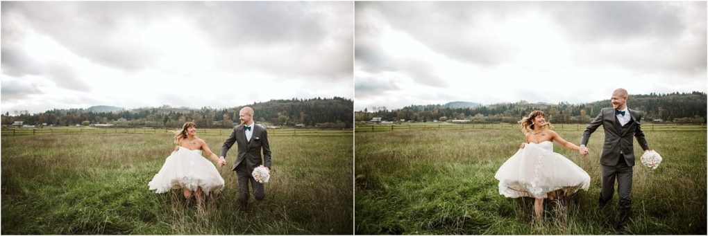 Premier snohomish & seattle wedding photographer | gsquared weddings photography a bride and groom walk hand in hand through a grassy field at their snohomish wedding smiling at each other The bride lifts her white dress slightly while the groom holds a bouquet Trees and hills are visible under a cloudy sky | serving snohomish seattle                   & beyond