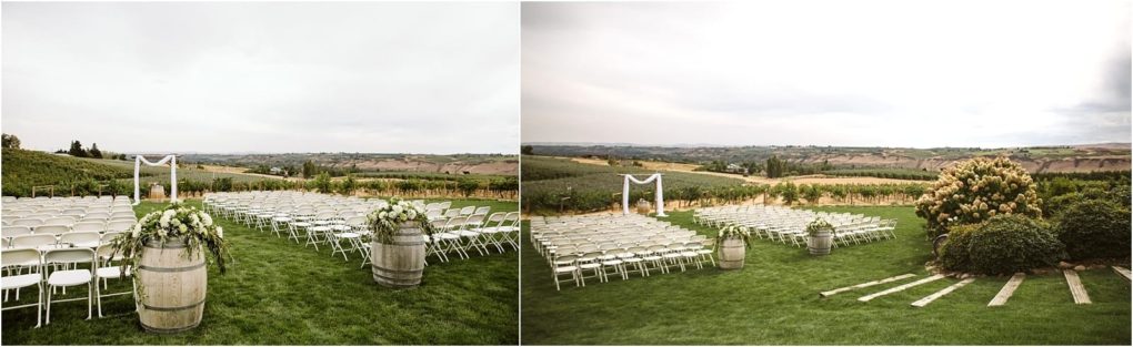 Premier snohomish & seattle wedding photographer | gsquared weddings photography outdoor wedding ceremony setup with rows of white chairs facing a simple arch and two decorated barrels set on a green lawn with vineyard covered hills in the background under a cloudy skyperfect for a snohomish seattle wedding | serving snohomish seattle                   & beyond