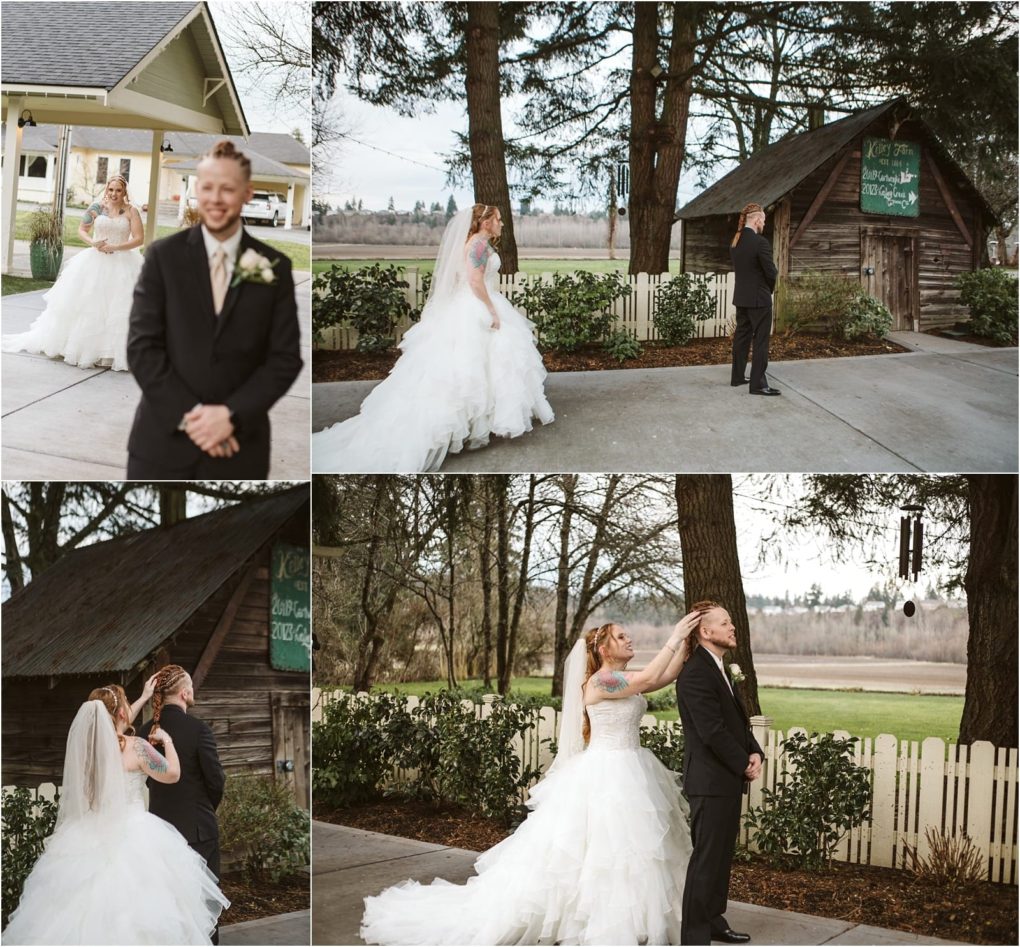 Premier snohomish & seattle wedding photographer | gsquared weddings photography a bride in a white gown approaches her groom for a first look outdoors in snohomish they smile and she taps his shoulder as he stands with his back to her surrounded by trees and rustic buildings near seattle | serving snohomish seattle                   & beyond