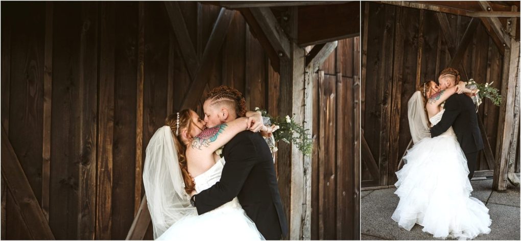 Premier snohomish & seattle wedding photographer | gsquared weddings photography a bride and groom embrace and kiss passionately in front of rustic wooden doors during their snohomish seattle wedding the bride in a white gown and veil the groom in a black suit with soft natural lighting highlighting their intimate moment | serving snohomish seattle                   & beyond