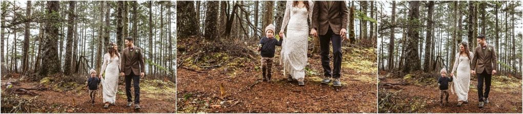 Premier snohomish & seattle wedding photographer | gsquared weddings photography a couple in wedding attire walks hand in hand with a small child through a forest near snohomish surrounded by tall trees and earthy ground The scene captures a joyful and serene seattle wedding engagement moment | serving snohomish seattle                   & beyond