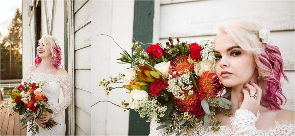 Premier snohomish & seattle wedding photographer | gsquared weddings photography a bride with blonde and pink hair in an off the shoulder lace gown holds a vibrant bouquet of red white and orange flowers standing against a white wooden building at a picturesque snohomish seattle wedding | serving snohomish seattle                   & beyond