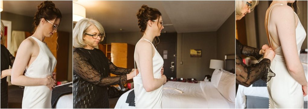 Premier snohomish & seattle wedding photographer | gsquared weddings photography a woman in a white dress is being helped by an older woman to zip up the back of her dress in a hotel room preparing for her snohomish wedding near seattle | serving snohomish seattle                   & beyond