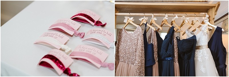 Premier snohomish & seattle wedding photographer | gsquared weddings photography on the left pink and white hair ties with wedding themed tags are displayed on a table On the right several dresses in blush and navy hang on wooden hangers ready for a snohomish seattle wedding | serving snohomish seattle                   & beyond