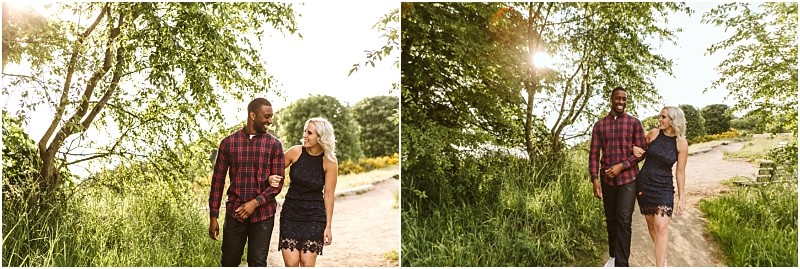 Premier snohomish & seattle wedding photographer | gsquared weddings photography a couple walks arm in arm on a sunny tree lined path in snohomish smiling at each other The green foliage and warm sunlight create a cheerful summery atmosphereperfect for a seattle wedding engagement session | serving snohomish seattle                   & beyond