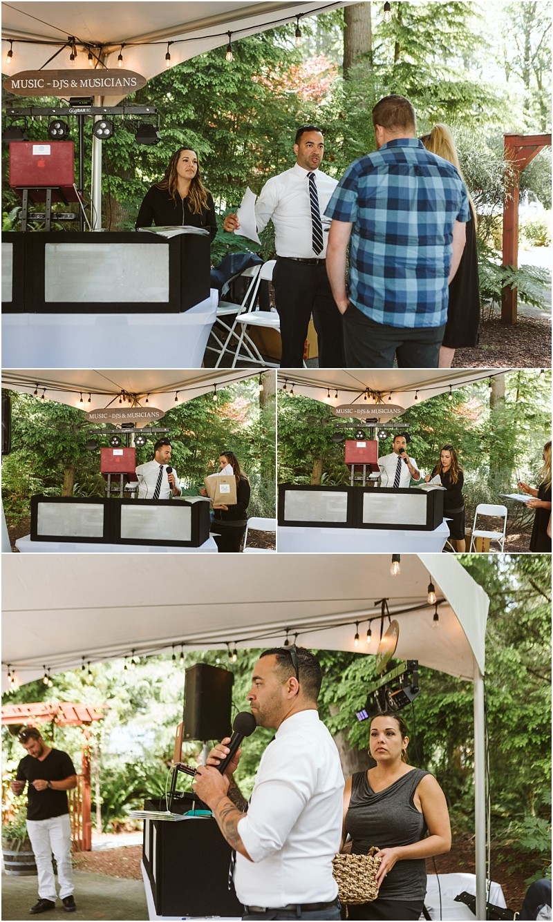 Premier snohomish & seattle wedding photographer | gsquared weddings photography a dj in a white shirt stands under a tent with equipment speaking to a small group at an outdoor snohomish wedding Surrounded by string lights and greenery other guests converse near the booth in this charming seattle engagement setting | serving snohomish seattle & beyond Premier snohomish & seattle wedding photographer | gsquared weddings photography a dj in a white shirt stands under a tent with equipment speaking to a small group at an outdoor snohomish wedding Surrounded by string lights and greenery other guests converse near the booth in this charming seattle engagement setting | serving snohomish seattle & beyond