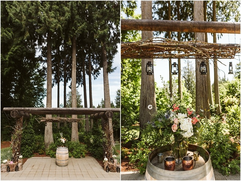 Premier snohomish & seattle wedding photographer | gsquared weddings photography a rustic outdoor wedding altar with wooden beams surrounded by tall trees near snohomish A floral arrangement and candles sit atop a wine barrel with lanterns hanging aboveperfect for a seattle wedding or engagement celebration | serving snohomish seattle & beyond Premier snohomish & seattle wedding photographer | gsquared weddings photography a rustic outdoor wedding altar with wooden beams surrounded by tall trees near snohomish A floral arrangement and candles sit atop a wine barrel with lanterns hanging aboveperfect for a seattle wedding or engagement celebration | serving snohomish seattle & beyond