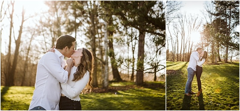 Premier snohomish & seattle wedding photographer | gsquared weddings photography a couple stands in a sunlit park embracing and kissing beneath tall trees The light filters through the branches casting a warm glow on the grassy landscapeperfect for a dreamy snohomish seattle wedding engagement moment | serving snohomish seattle                   & beyond