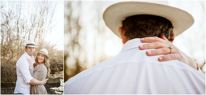 Premier snohomish & seattle wedding photographer | gsquared weddings photography a couple wearing light hats embraces outdoors near trees smiling at the camera in a close up the womans hand with an engagement ring rests on the man's shoulder during their Snohomish Seattle wedding engagement, sunlight shining in the background.                                   | Serving Snohomish, Seattle ,                  & Beyond