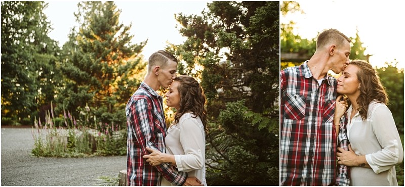Premier snohomish & seattle wedding photographer | gsquared weddings photography a couple stands outdoors near trees at sunset embracing closely Captured during their snohomish seattle engagement the man kisses the womans forehead as she rests her hand on his chest both appear affectionate and serene | serving snohomish seattle                   & beyond