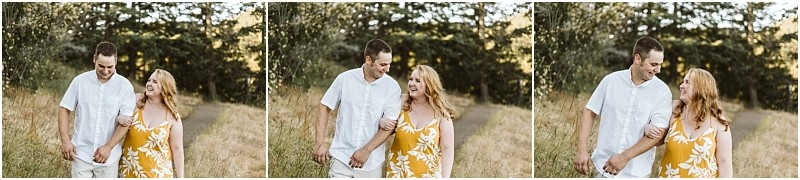 Premier snohomish & seattle wedding photographer | gsquared weddings photography a couple walks together on a grassy path near snohomish smiling and looking at each other Perfect for a seattle wedding engagement shoot the man wears a white shirt and the woman wears a yellow floral dress amid trees and tall grass | serving snohomish seattle & beyond Premier snohomish & seattle wedding photographer | gsquared weddings photography a couple walks together on a grassy path near snohomish smiling and looking at each other Perfect for a seattle wedding engagement shoot the man wears a white shirt and the woman wears a yellow floral dress amid trees and tall grass | serving snohomish seattle & beyond