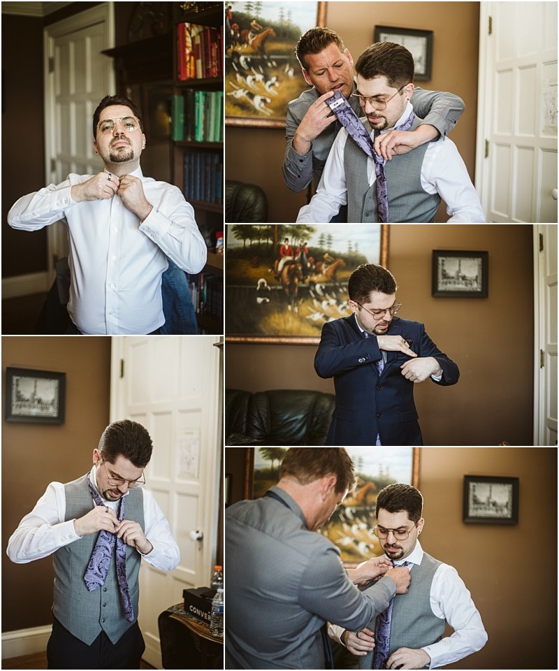 Premier snohomish & seattle wedding photographer | gsquared weddings photography a man in formal attire is helped by another man to put on a tie and jacket in a cozy room Smiling as they prepare for a snohomish seattle wedding they adjust the tie together Shelves artwork and warm lighting set the scene | serving snohomish seattle                   & beyond