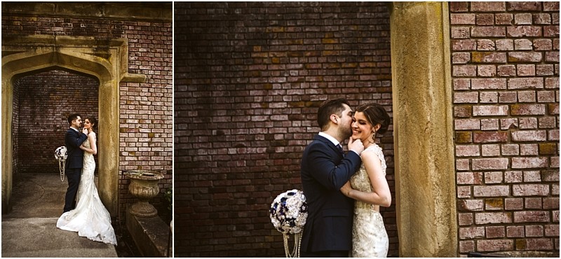 Premier snohomish & seattle wedding photographer | gsquared weddings photography a bride and groom embrace and smile at each other in front of a brick wall and stone archway during their snohomish seattle wedding the bride in a white dress and the groom in a dark suit sharing a romantic joyful moment | serving snohomish seattle                   & beyond