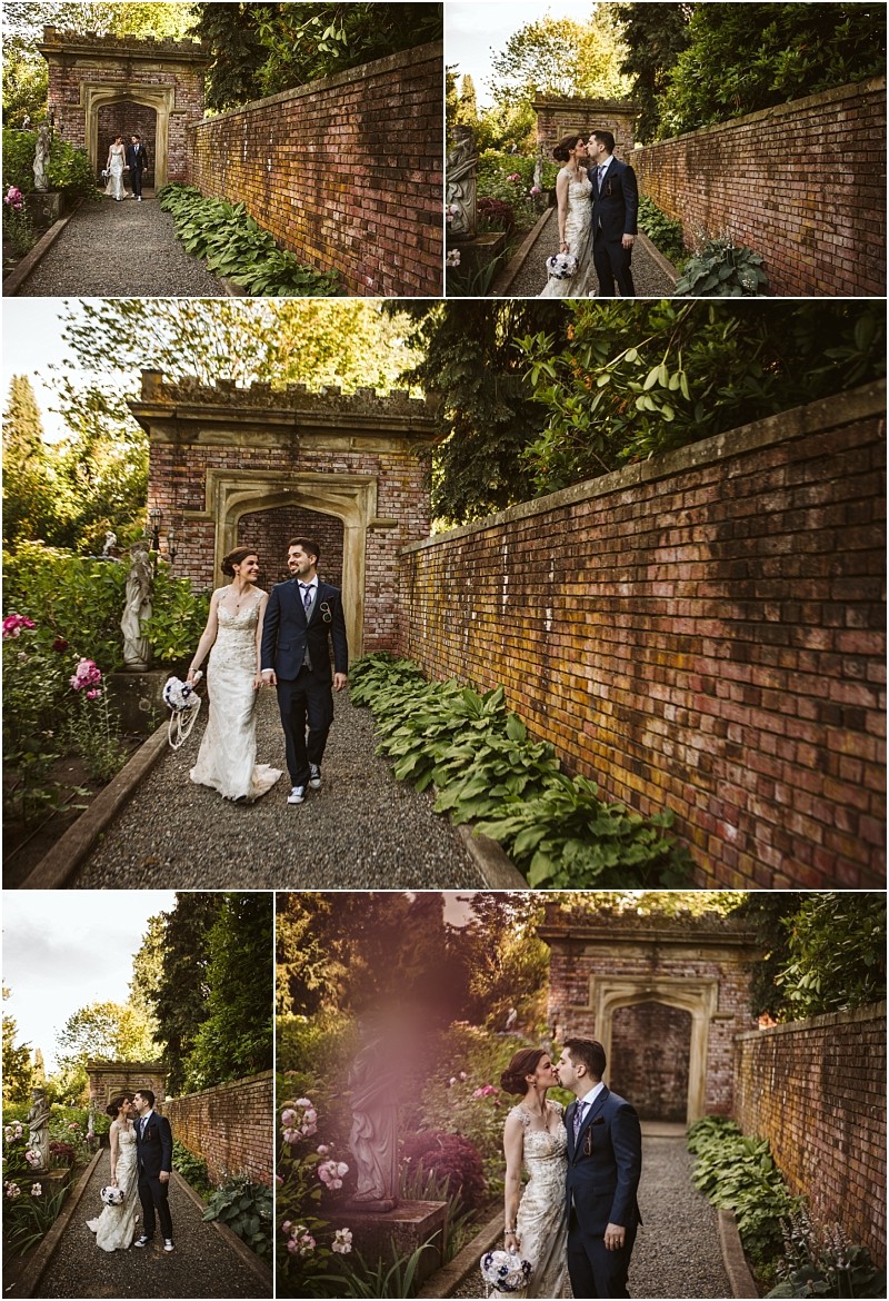Premier snohomish & seattle wedding photographer | gsquared weddings photography a bride and groom walk together along a gravel path beside a brick garden wall holding hands and smiling at each other surrounded by lush greenery and flowers during their snohomish wedding engagement | serving snohomish seattle                   & beyond