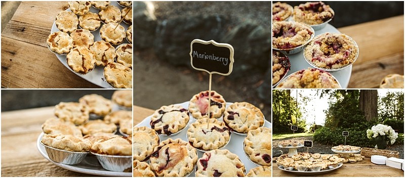 Premier snohomish & seattle wedding photographer | gsquared weddings photography an assortment of mini marionberry pies displayed on wooden tables outdoors at a snohomish wedding with small chalkboard signs labeling the pies Some have lattice tops and there are trees and flowers in the background | serving snohomish seattle                   & beyond