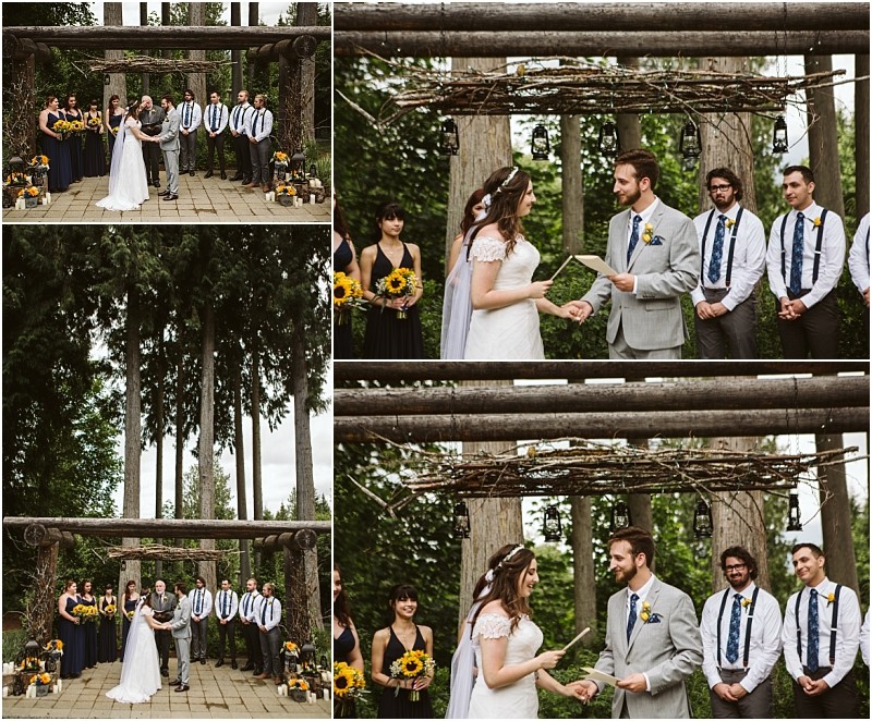 Premier snohomish & seattle wedding photographer | gsquared weddings photography a bride and groom exchange vows outdoors under a rustic wooden arch at a snohomish seattle wedding surrounded by bridesmaids holding sunflowers and groomsmen in suspenders set against a backdrop of tall trees | serving snohomish seattle                   & beyond