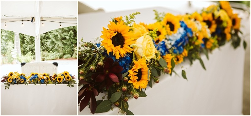Premier snohomish & seattle wedding photographer | gsquared weddings photography a white table decorated with a vibrant floral arrangementsunflowers blue and yellow roses greenery and accent flowerssits beautifully under a white tent perfect for a romantic snohomish seattle wedding or engagement celebration | serving snohomish seattle                   & beyond