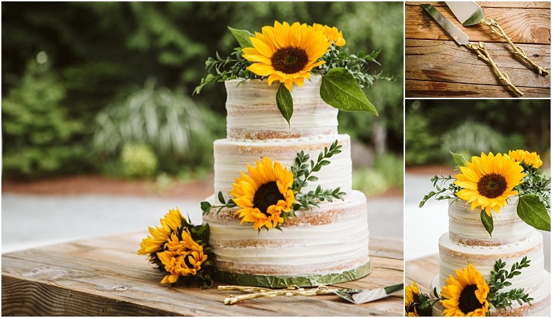 Premier snohomish & seattle wedding photographer | gsquared weddings photography a two tier naked cake decorated with sunflowers and greenery sits on a rustic wooden table perfect for a snohomish or seattle wedding Gold cake cutting utensils and a server are nearby with blurred greenery in the background | serving snohomish seattle                   & beyond