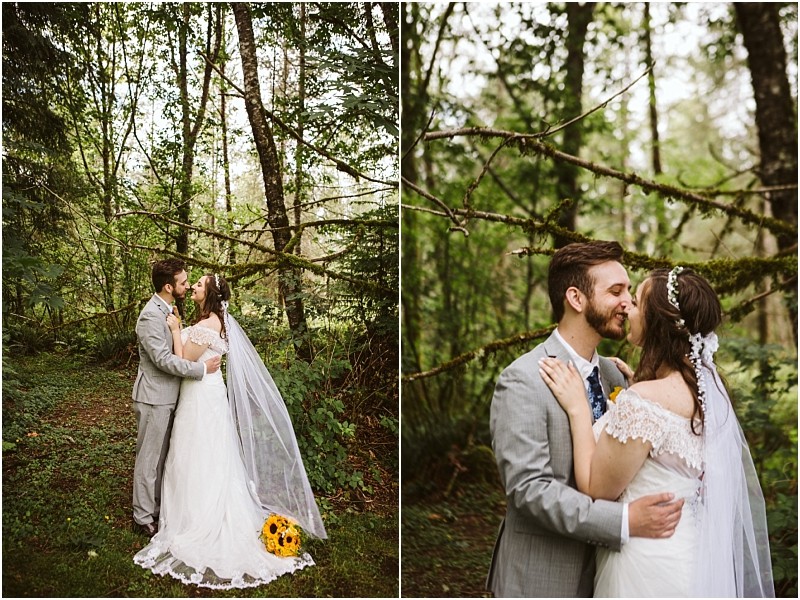 Premier snohomish & seattle wedding photographer | gsquared weddings photography a bride and groom share a kiss among the trees in a lush green forest during their snohomish wedding The groom wears a gray suit while the bride in a white gown with veil and yellow bouquet embraces him in this enchanting seattle engagement moment | serving snohomish seattle                   & beyond