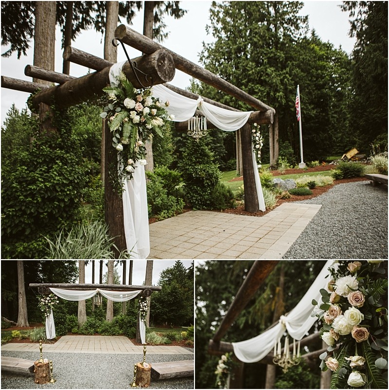 Premier snohomish & seattle wedding photographer | gsquared weddings photography a rustic outdoor wedding arch made of wooden logs draped with white fabric and adorned with blush roses greenery and tasselsperfect for a dreamy snohomish seattle wedding or engagement nestled among trees on a stone and gravel path | serving snohomish seattle & beyond Premier snohomish & seattle wedding photographer | gsquared weddings photography a rustic outdoor wedding arch made of wooden logs draped with white fabric and adorned with blush roses greenery and tasselsperfect for a dreamy snohomish seattle wedding or engagement nestled among trees on a stone and gravel path | serving snohomish seattle & beyond