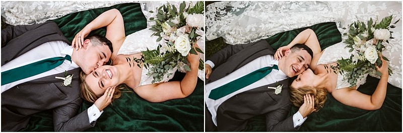 Premier snohomish & seattle wedding photographer | gsquared weddings photography a bride and groom lie on a green blanket smiling and laughing during their snohomish seattle wedding engagement The groom in a gray suit with a green tie kisses the brides cheek as she holds a bouquet of white flowers in her lace dress | serving snohomish seattle                   & beyond