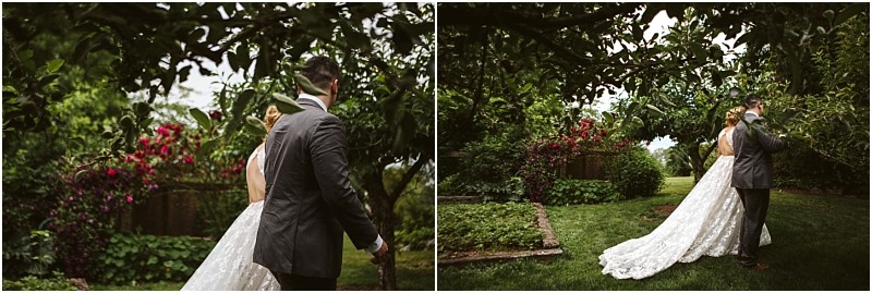 Premier snohomish & seattle wedding photographer | gsquared weddings photography a bride in a white gown approaches a groom in a grey suit outdoors surrounded by lush greenery and flowering plants This romantic snohomish seattle wedding scene captures the couple holding hands in a beautiful garden facing away from the camera | serving snohomish seattle                   & beyond