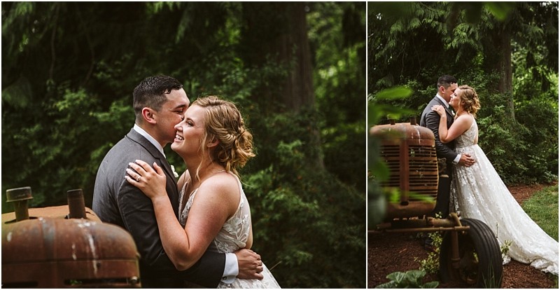 Premier snohomish & seattle wedding photographer | gsquared weddings photography a bride and groom embrace and smile beside a rusty tractor in a lush green outdoor setting near snohomish surrounded by tall trees and foliagethe perfect backdrop for a seattle wedding or engagement | serving snohomish seattle                   & beyond